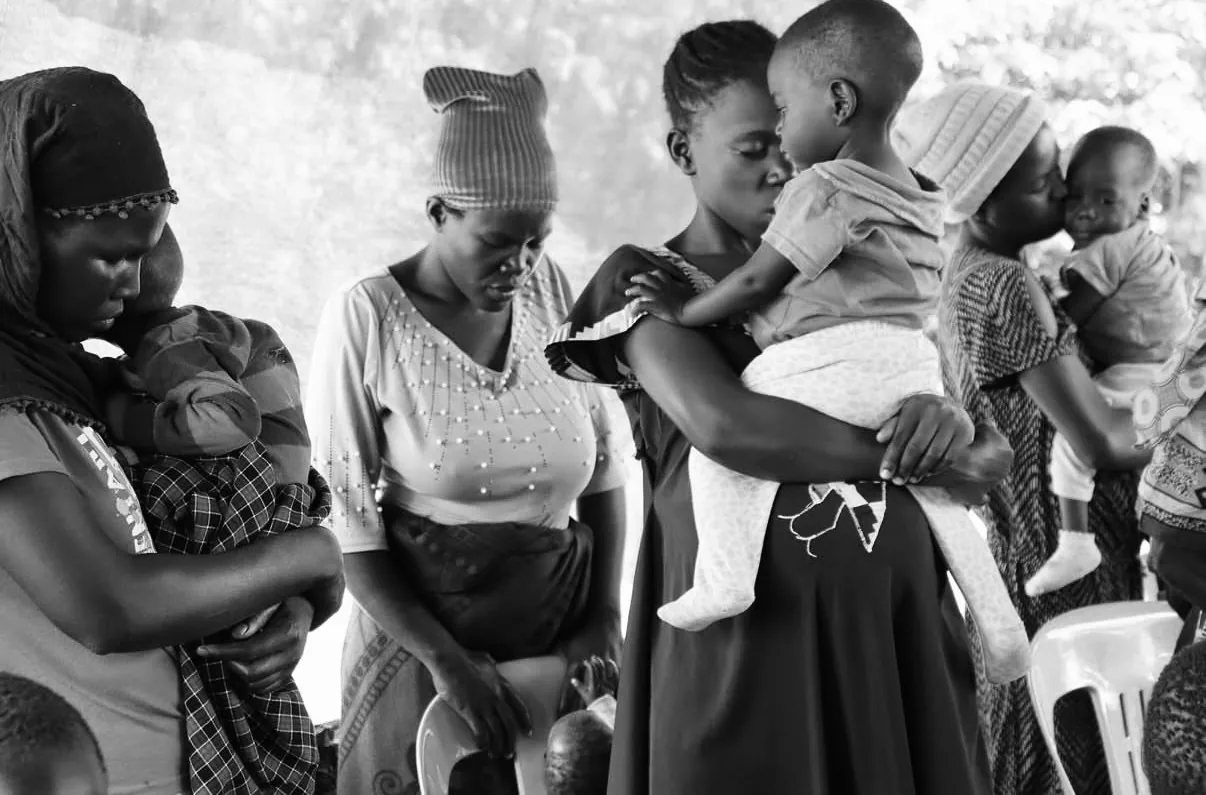 Ugandan mothers holding their children, GSF Care Fund, Global Outreach International